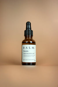 Packaged in a small, eco-friendly glass pipette bottle, the Beam Facial Oil by Balm Wellness combines 100% organic cold-pressed hemp seed oil and neroli to nurture and revitalise skin.